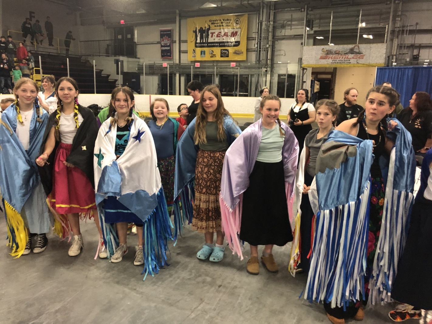 A group of people posing for a photo

Description automatically generated
