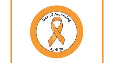 An orange circle with an orange ribbon inside signifying the National Day of Mourning